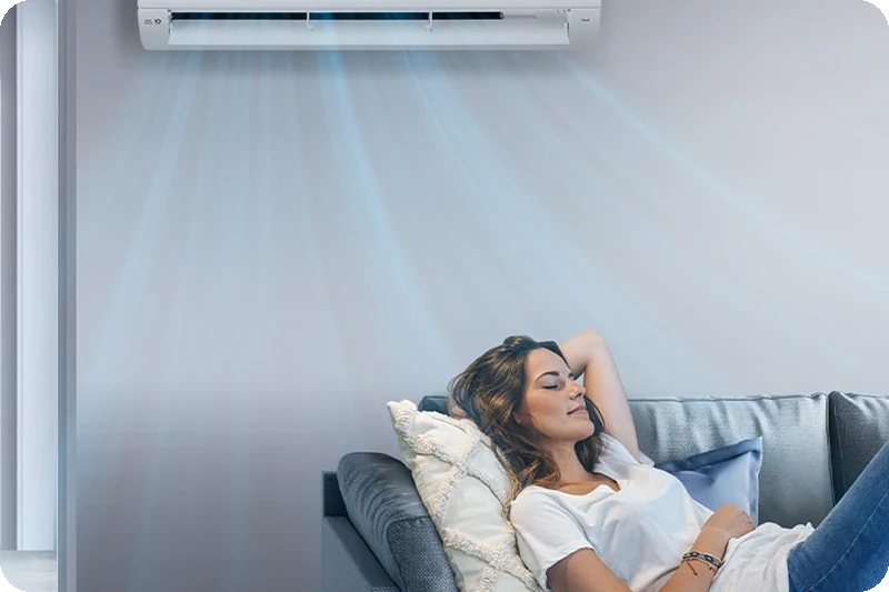 A person sleeping comfortably while the LG air conditioner operates.